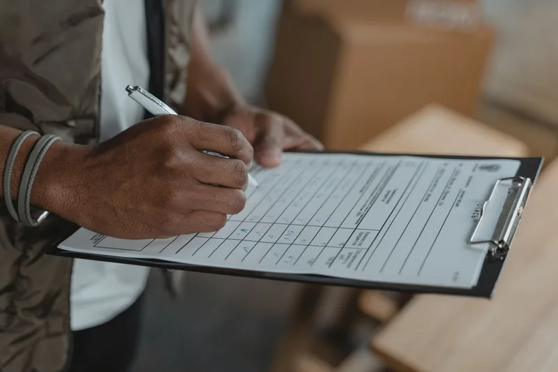 Checklist on a clipboard with a pen, representing a vendor evaluation checklist