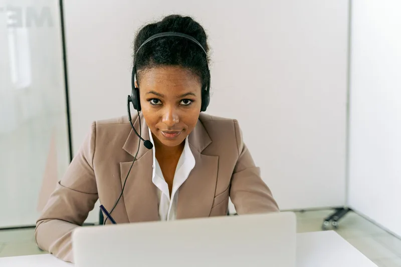 Customer service representative wearing a headset ready to handle conversations