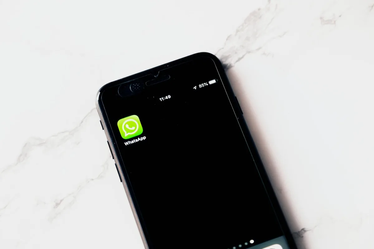 WhatsApp blasting for Malaysian businesses — professional with smartphone sending broadcast campaigns to multiple customers