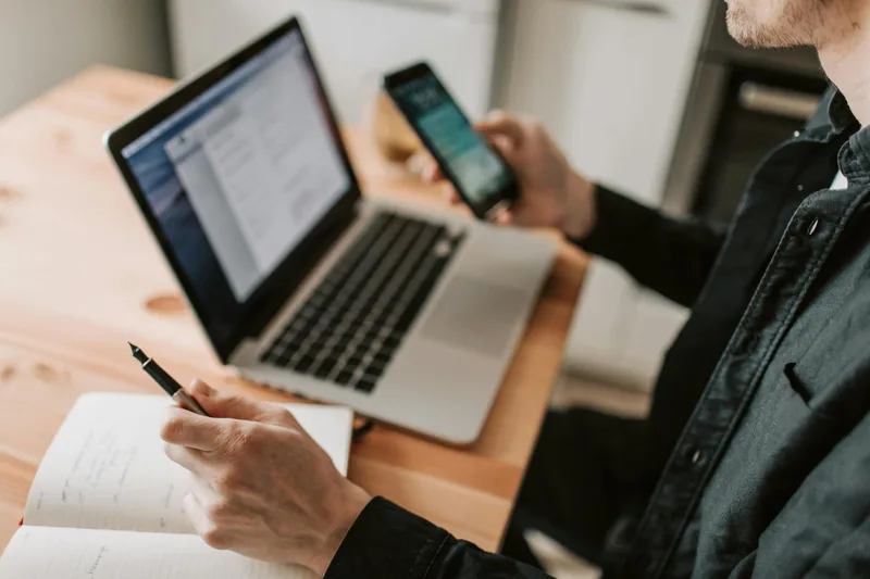 Business owner composing WhatsApp blast message on smartphone — focused view of chat interface with draft message