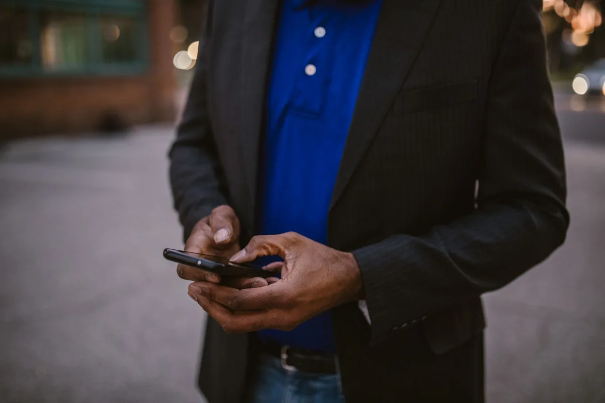 Business owner setting up WhatsApp Business on smartphone